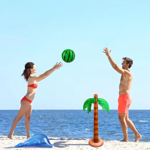 Luau Party Inflatable Decor Set with a fringed coconut tree, inflatable watermelon, and dolphin on a beach setting