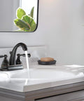 Elmhurst Two-Handle Centerset Bath Faucet In Oil Rubbed Bronze 3-Hole 4-Inch Install shown in bathroom setting