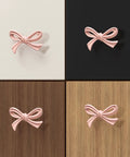 Pink Bow Dresser Knobs 16 Pack Small Decorative Cabinet Drawer Pulls for Girls Bedroom and Nursery Decor on various wood finishes