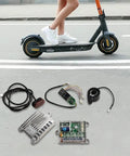 Plug And Play Electric Scooter Controller Kit 7 Piece Set With Easy Install High Performance Circuit Board for Xiaomi M365 laid out on ground