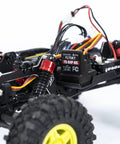 Close-up of 1/18 RC Crawler Pro Juice Up Edition RTR with HBW Electronics showing brushless power setup and rugged tires.