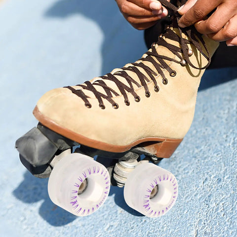 Person tying laces on roller skate with 2 Pack LED Light Up Roller Skate Replacement Wheels For Quad Skates Glow Wheels.