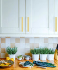 Premium Slick 5 Inch 128 mm Brushed Gold Cabinet Handles And Drawer Pulls For Kitchen Cupboards, showcased on modern white cabinets.