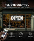 40 Inch By 14 Inch LED Open Sign With Remote Control displayed at cafe front, showcasing brightness and control icons.