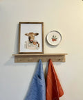Heavy Duty Polished Brass Plate Hanger For Wall Display With Non Scratch Hooks holds decorative round plate on wall