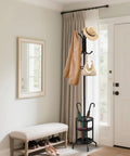 Dope Freestanding Coat Rack With 12 Hooks And Umbrella Holder in entryway, holding coat and hat, black metal finish