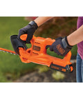 Person using 20V Max Cordless Hedge Trimmer With 18 Inch Dual Action Blade Delivers Up To 2400 Cuts Per Minute Handles