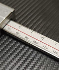 Close-up of Ball Tip Digital Wall Thickness Caliper 0-6 Inch Electronic Caliper with LCD Display on carbon surface.