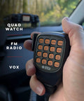 Hand holding microphone of UV50X2 Second Gen Beefy 50 Watt Dual Band Base Mobile Radio for VHF UHF Amateur Ham in car setting