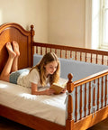 Grey Soft Padding Panels for Kid Spaces and Stairs Rails with Tie Straps Edge Guard on wooden bed in a bright room.