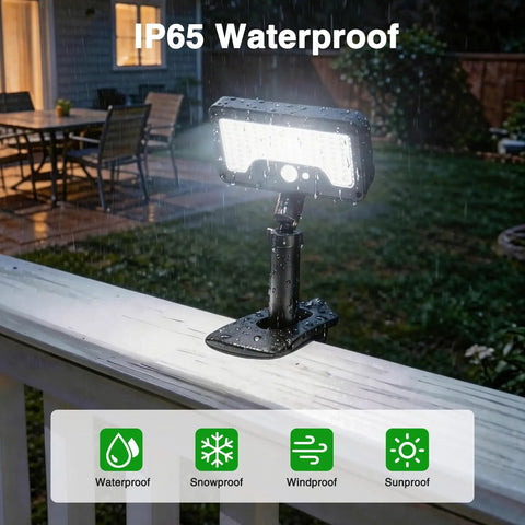 Heavy Duty Solar Motion Lights Clip On For Fence Deck And Gutter 92 Led Security Spotlight in rain on a white railing.