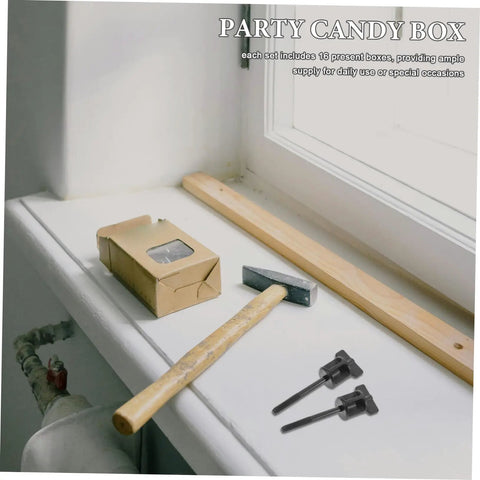 Window ledge with hammer, wood plank, cardboard box, two black T-shaped tools