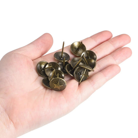 Hella Durable Upholstery Tacks Nail Pins 100 Piece Pack 16Mm Head 20Mm Shank Carbon Steel Yellow Bronze Electroplated Finish for tough furniture DIY projects held in a hand.