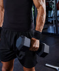 Man lifting weights wearing 2 Pack Adjustable Wrist Brace Set for Fitness and Weightlifting, Keeps Tendonitis in Check.