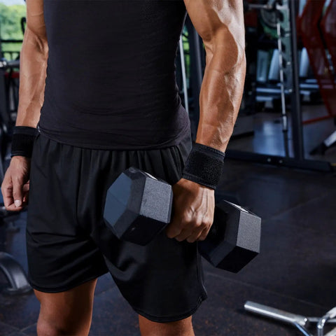 Man lifting weights wearing 2 Pack Adjustable Wrist Brace Set for Fitness and Weightlifting, Keeps Tendonitis in Check.