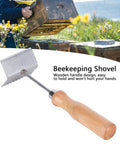 Bee Extractor Shovel For Beehives With Wood Handle Queen Bee Excluder Cleaner Frame Scraper Tool in outdoor setting