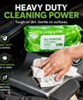Hand using All Purpose Cleaning Wipes 70 Count Extra Large 8 By 10 Inches Heavy Duty Wipes For Car Interior Kitchen Bathroom