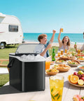 Countertop Ice Maker With Handle Auto Clean Portable Ice Maker 26 Lbs In 24 Hours in use at a picnic with a camper in background