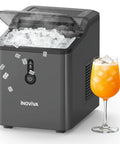 Countertop Nugget Ice Maker Pebble Ice Machine Six Minute Quick Snap Self Cleaning Compact Portable Design Cranks Out Twenty Six Pounds Soft Chewable Ice Daily Built For Home Office Or Game Day Bash with ice in view.