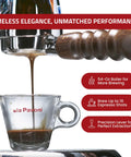 Handcrafted Italian 16 Cup Lever Espresso Machine Featuring Chrome Copper Body And Rosewood Handles Dual Frothing System A Straight Up Kitchen Showstopper For Smooth Morning Pulls with espresso pouring into a glass cup.