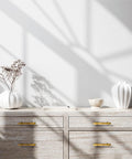Modern dresser with 30 Pack Brushed Brass Cabinet Handles 3 Inch Modern Square Drawer Pulls, gold finish against neutral decor backdrop.