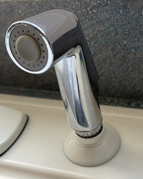 Universal Sink Sprayer Attachment for Kitchen Side Sprayer Head Pull Out Spray Head Replacement in chrome finish on sink