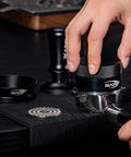 58Mm Espresso Tool Kit 6 In 1 with tamper, distributor, and mat in use, showcasing precise espresso preparation.