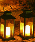 2-Pack Solar Lanterns For Outdoor Garden Hanging Lights 11.8 Inch Flickering Flameless Candles glowing at night.