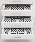 Drawer lined with Black And White Geometric Peel And Stick Wallpaper For DIY Projects Repositionable And Removable With No Residue.