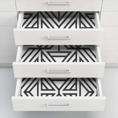Drawer lined with Black And White Geometric Peel And Stick Wallpaper For DIY Projects Repositionable And Removable With No Residue.