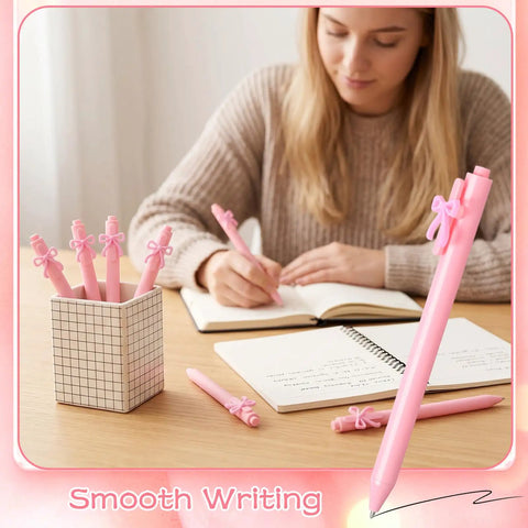 Woman writing with Pink Bow Pens Set 10 Pack Aesthetic Retractable Ballpoint Pens With Cute Bow Decor, Smooth Black Ink