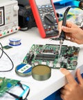 Person using soldering iron on circuit board with No Clean Solder Flux Paste For Electronics Repair And PCB Soldering Pro Grade Flux Cream