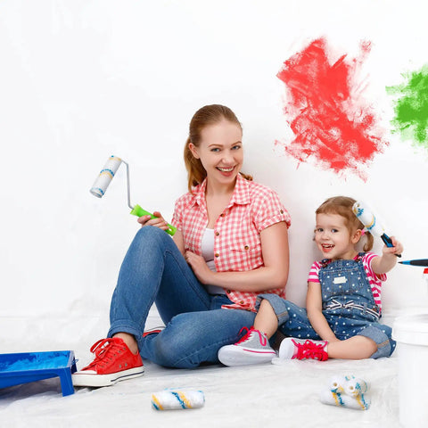 Mother and child using Bulk Pack 100 Mini Paint Roller Covers 6 Inch for quick home painting DIY projects on wall.