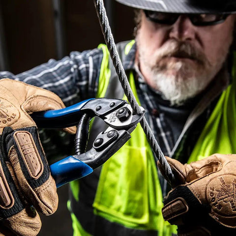 Worker using Beefy Heavy Duty Cable Cutter for ACSR and Hardened Wire Center Cut Jaws Locking Handles Plastic Coated Grips cutting wire
