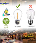 Comparison of energy-saving S14 LED Outdoor String Light Bulbs 2200K Warm White and incandescent bulb with outdoor patio lighting.