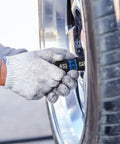Person using Half Inch Drive Lug Nut Impact Socket Set 5 Piece Thin Wall Flip Sockets with 3 Inch Extension Bar on car tire