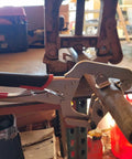 10 Inch Locking Pipe Clamp With Swivel V Pads For Welding And Repair, One-Hand Lock, holding pipe in workshop setting