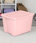 Pink 18 Gallon Storage Bin With Secure Snap On Lid Heavy Duty Stackable Plastic Tote Clutch For Moving Essentials And Home Organization Space Flex Game Changer in a room setting.