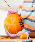 Child carving pumpkin wearing Kids Cut Resistant Gloves Level 5 Protection For Cooking Wood Carving Whittling Gardening And DIY Projects Food Grade Safe Small Size For Ages 4-6 Years Pink Green Or Gray