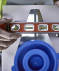 Magnetic Aluminum Reinforced Torpedo Level 12 Inch Red With Hands Free Magnetic Edge in use on metal surface.