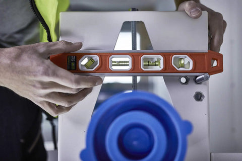 Magnetic Aluminum Reinforced Torpedo Level 12 Inch Red With Hands Free Magnetic Edge in use on metal surface.