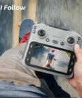 Hand holding 4.5 inch HD controller showing GPS drone with 4K EIS camera tracking skateboarder, part of GPS Drone With 4K EIS Camera And 4.5 Inch HD Controller Screen.