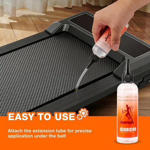 Silicone Treadmill Belt Lubricant 8 Oz Total With 2 Long Nozzle Tubes applied on treadmill belt for noise and friction reduction.