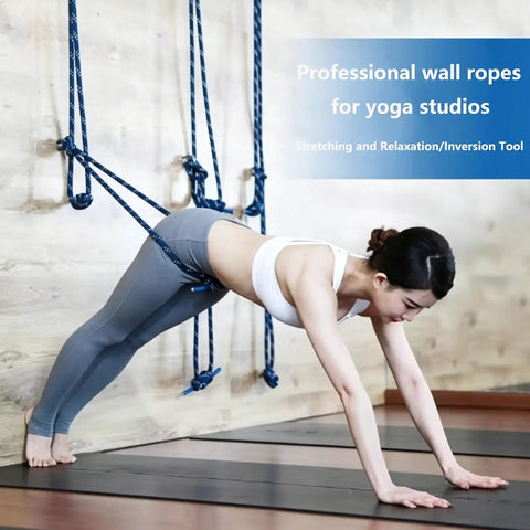 Wall Mounted Yoga Rope Kit For Deep Stretching And Spinal Mobility Posture Support Back Shoulder Hip Tension Relief Home Or Studio Practice Easy Setup Pro Grade Durable Anchor System, woman using blue wall ropes in yoga studio