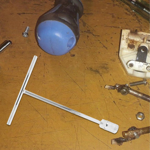 High Carbon Steel T Handle Socket Wrench With Hex Grip on a workbench, showcasing durability and multipurpose use for mechanics.