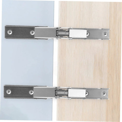 Front view of two HAKIDZEL folding cabinet hinge brackets in metal, mounted between blue and wood panels.