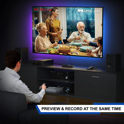 Man using VHS to digital converter and recorder with remote, converting video on a TV screen, plug and play, no PC needed.