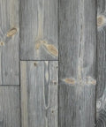 Heritage Gray Reactive Water Based VOC Free Interior Wood Stain 55 Gallon Tank on weathered gray wood planks with natural knots.