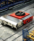 Rock Steady Electric Skates Mover With Wireless Remote Control Industrial Dolly on factory floor with heavy-duty design.