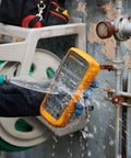 Pro Grade True RMS Digital Multimeter Kit with Premium Leads and ToolPak, IP67 Waterproof, being tested under running water